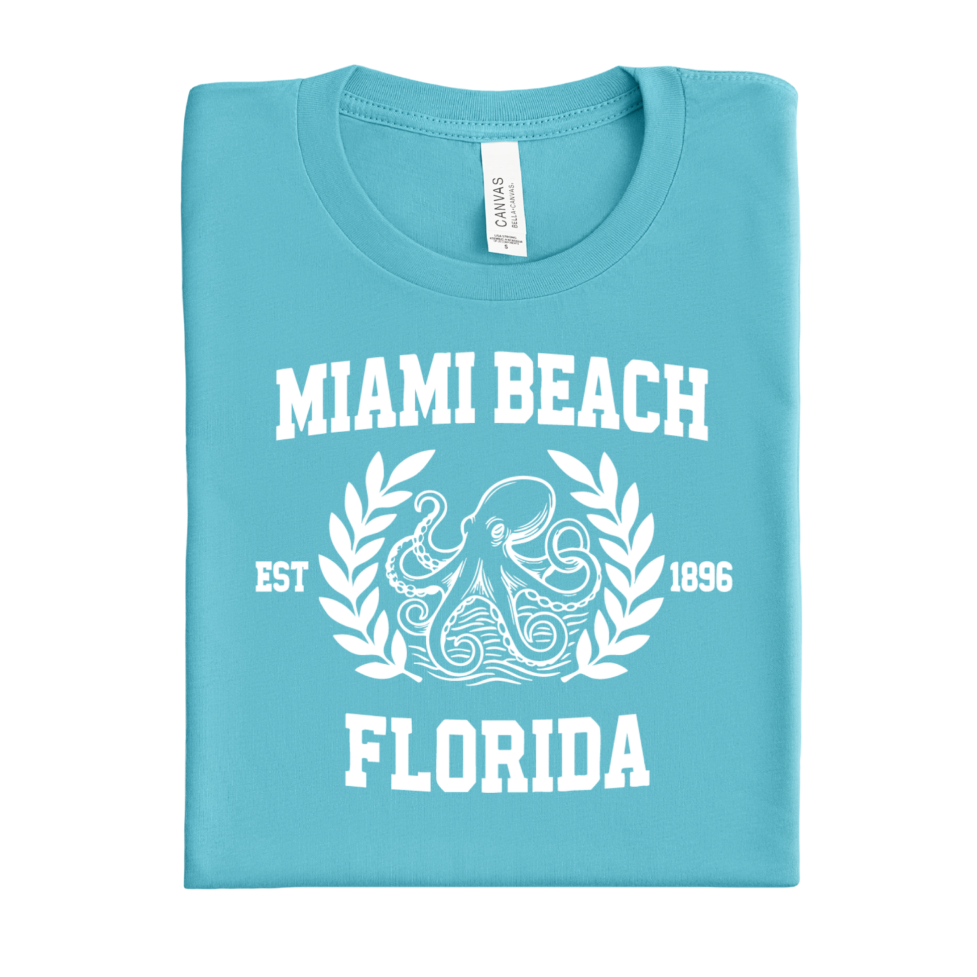 Folded turquoise  t-shirt with 'Miami Beach, Florida' text and octopus design on a white background