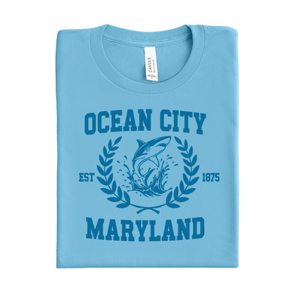 Folded ocean blue t-shirt with 'Ocean City, Maryland' design on a white background