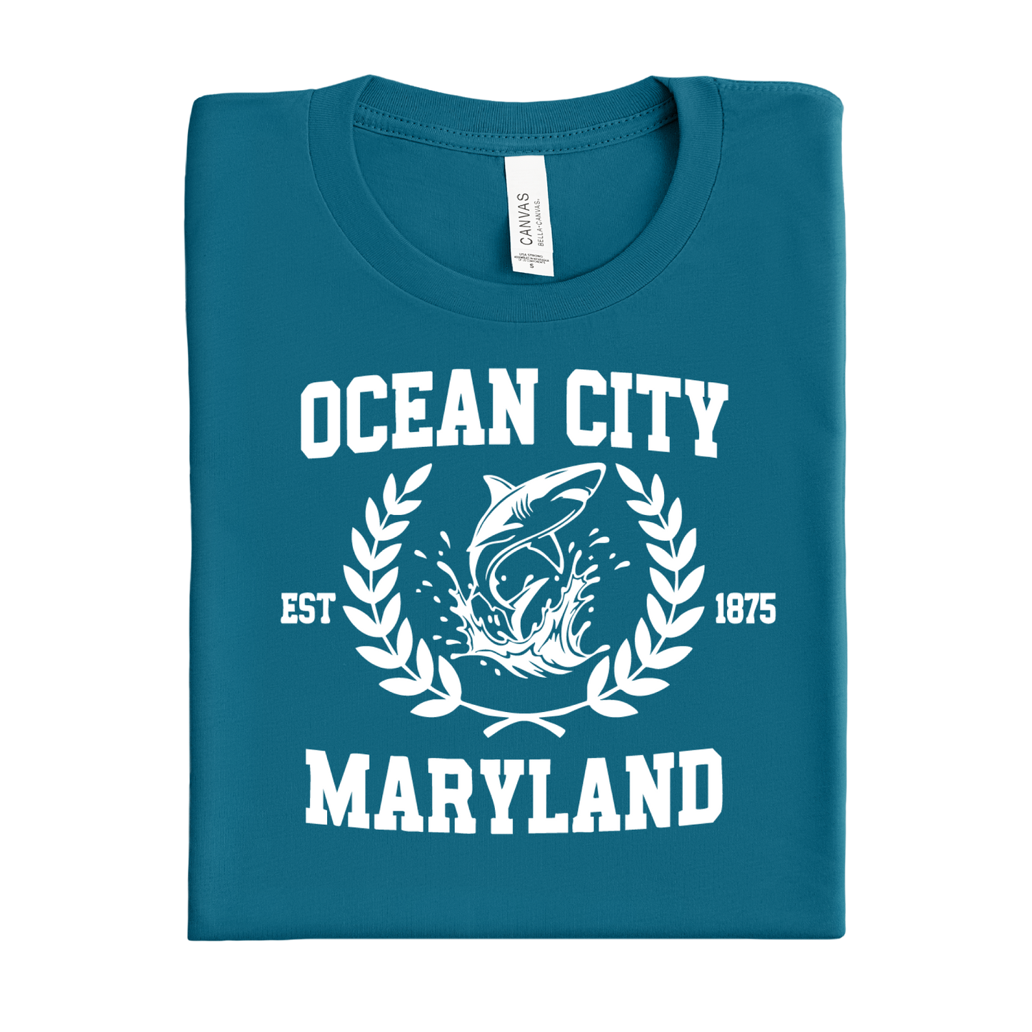Folded deep teal t-shirt with 'Ocean City, Maryland' text and shark graphic on a white background