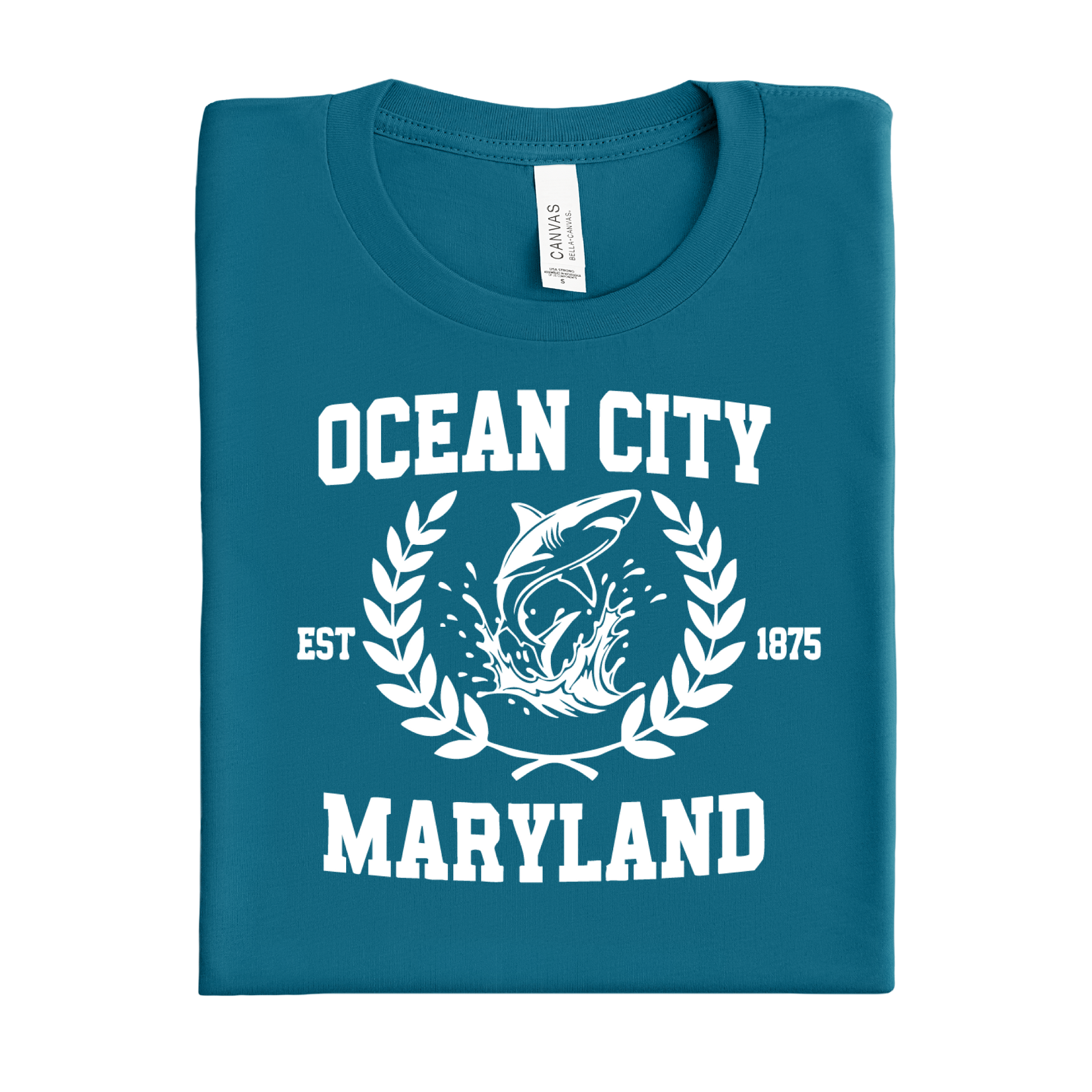 Folded deep teal t-shirt with 'Ocean City, Maryland' text and shark graphic on a white background