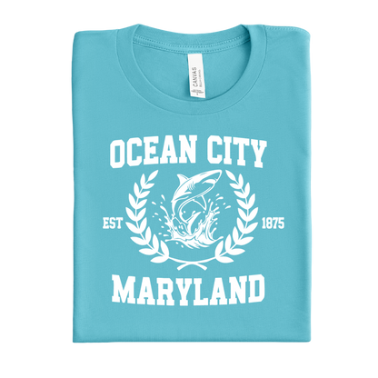 Folded turquoise t-shirt with 'Ocean City, Maryland' design on a white background