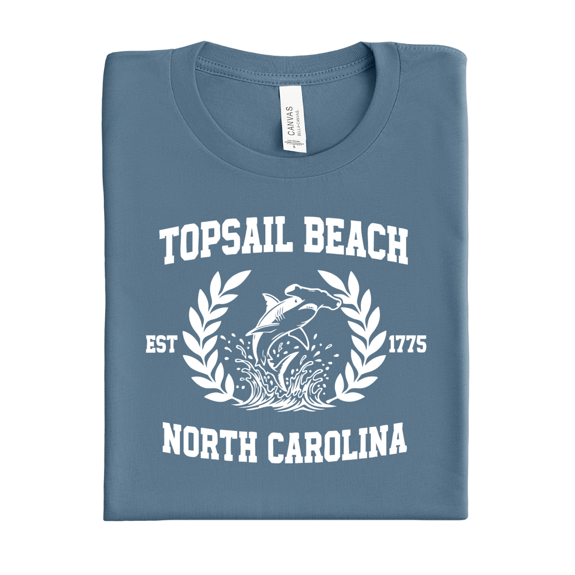 Folded steel blue t-shirt with 'Topsail Beach, North Carolina' design on a white background