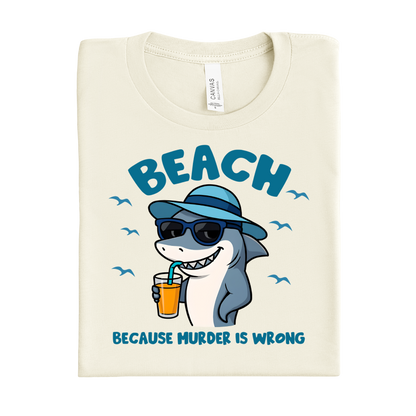 Beach-themed t-shirt with a shark graphic and text on a white background