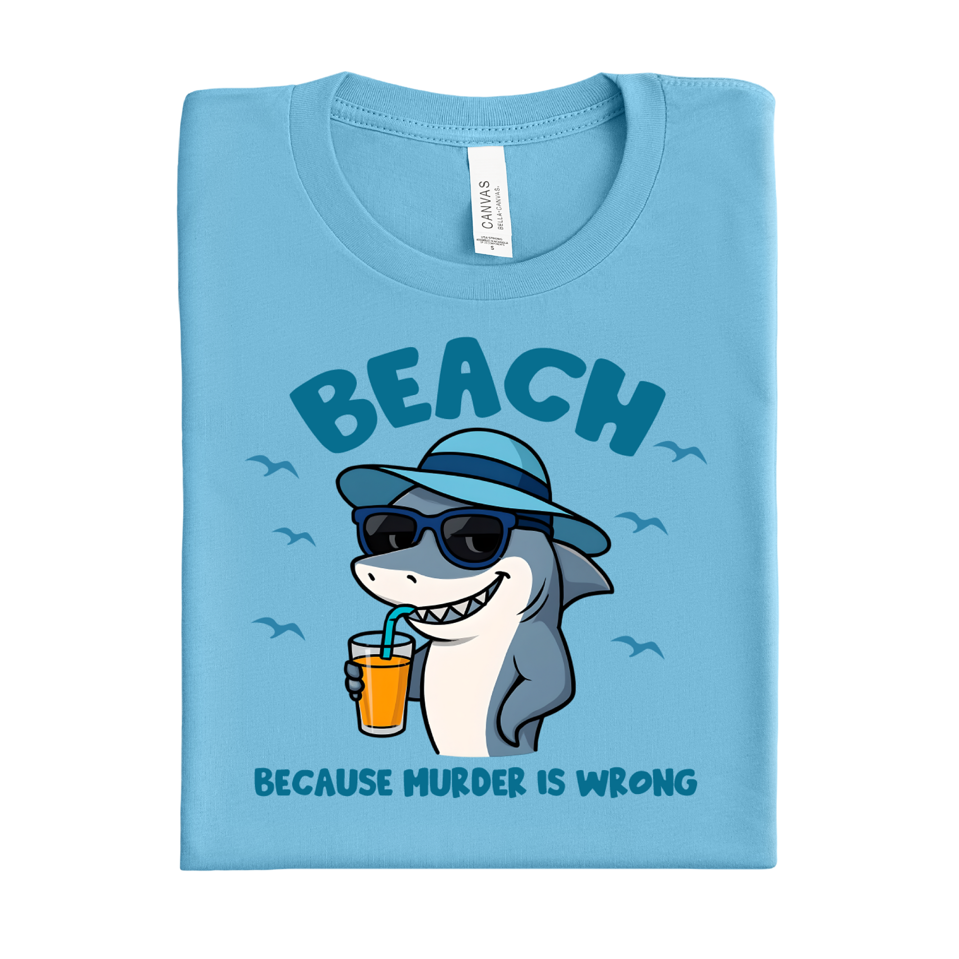 Folded ocean blue t-shirt with a shark graphic and text on a white background