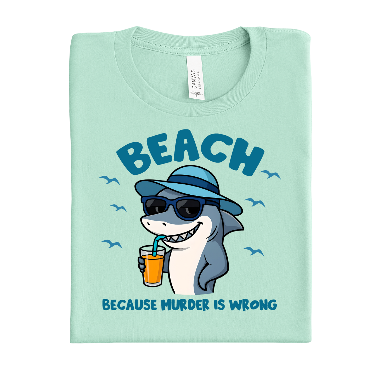 Mint green t-shirt with a shark graphic and text on a white background
