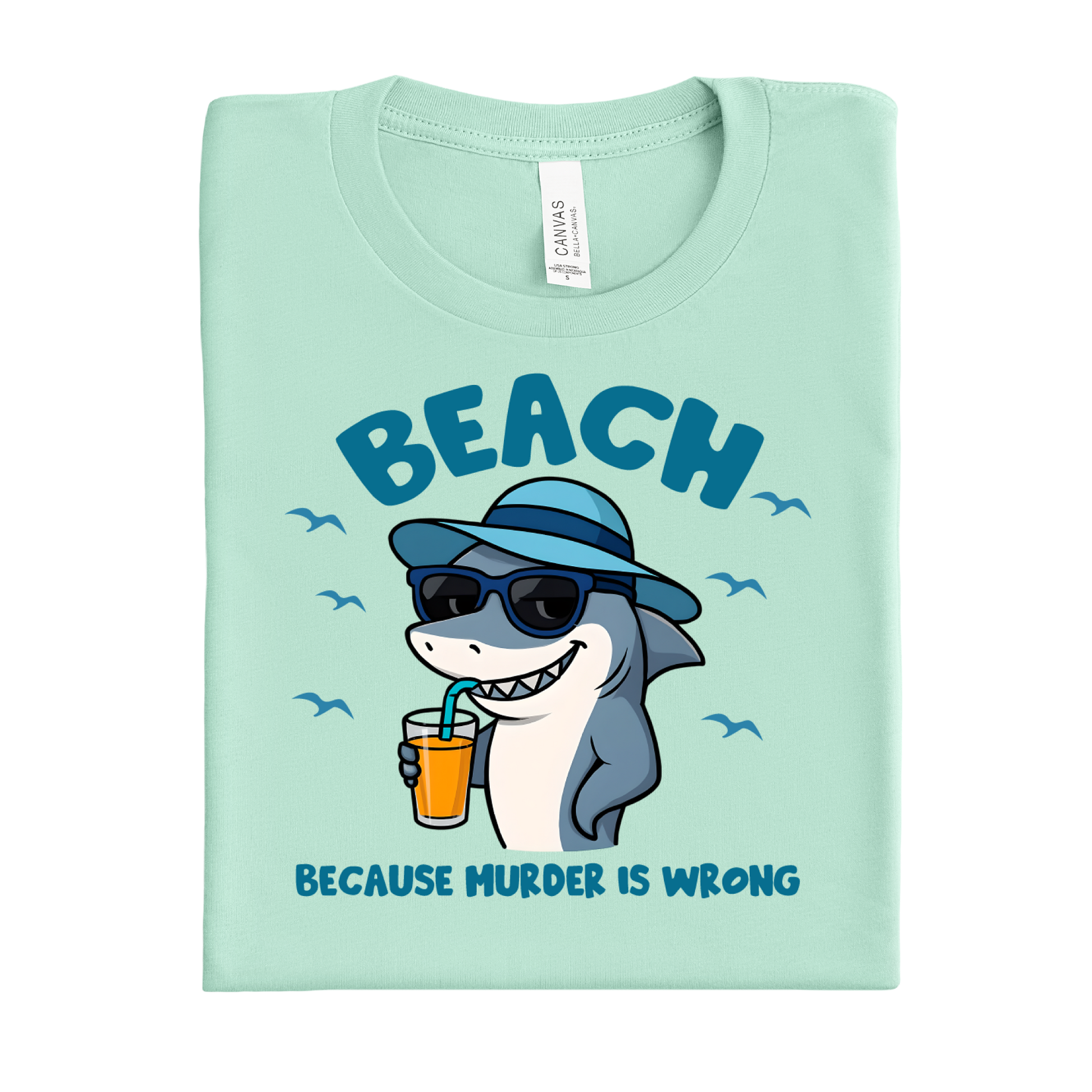 Mint green t-shirt with a shark graphic and text on a white background