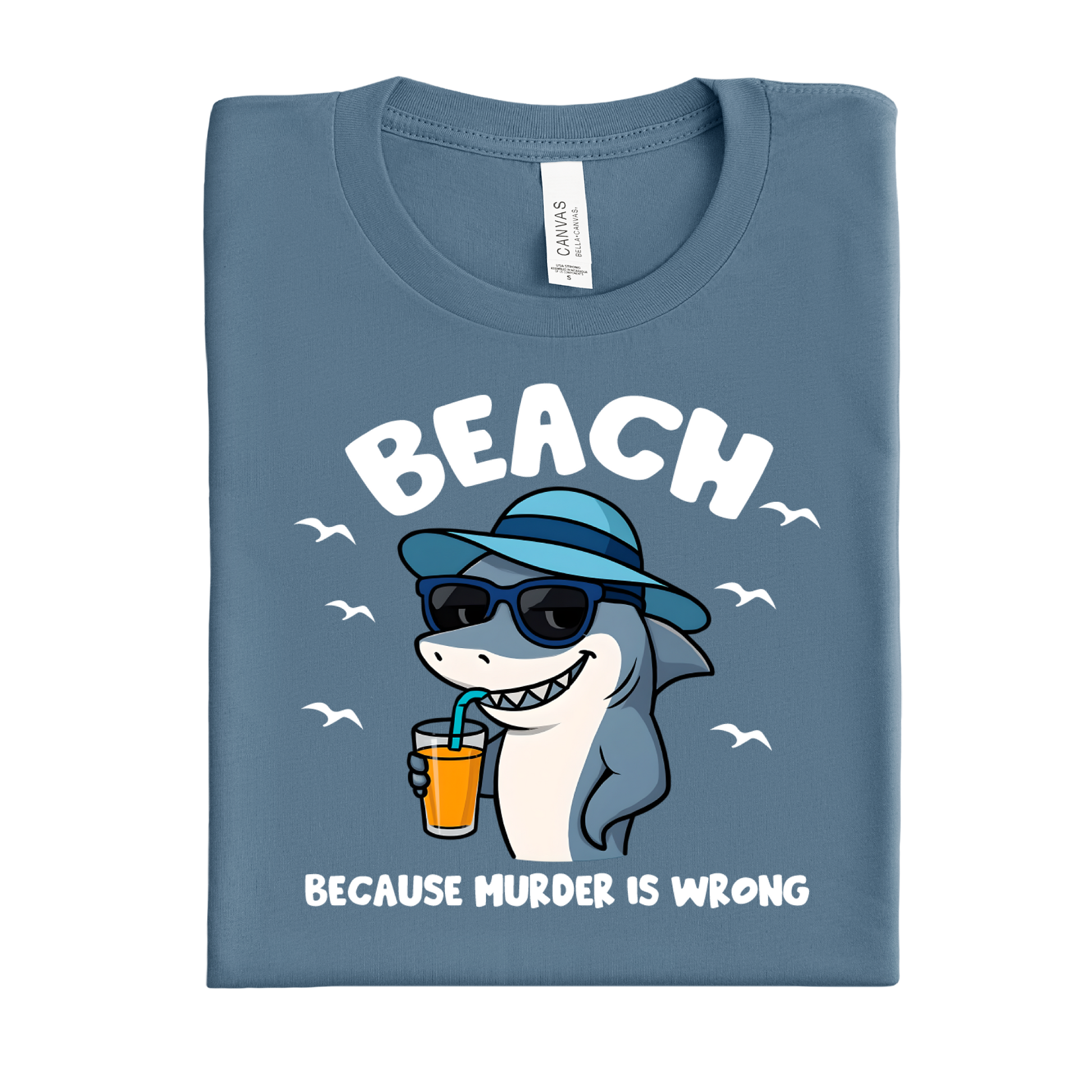 Folded indigo blue t-shirt with a shark graphic and text on a white background