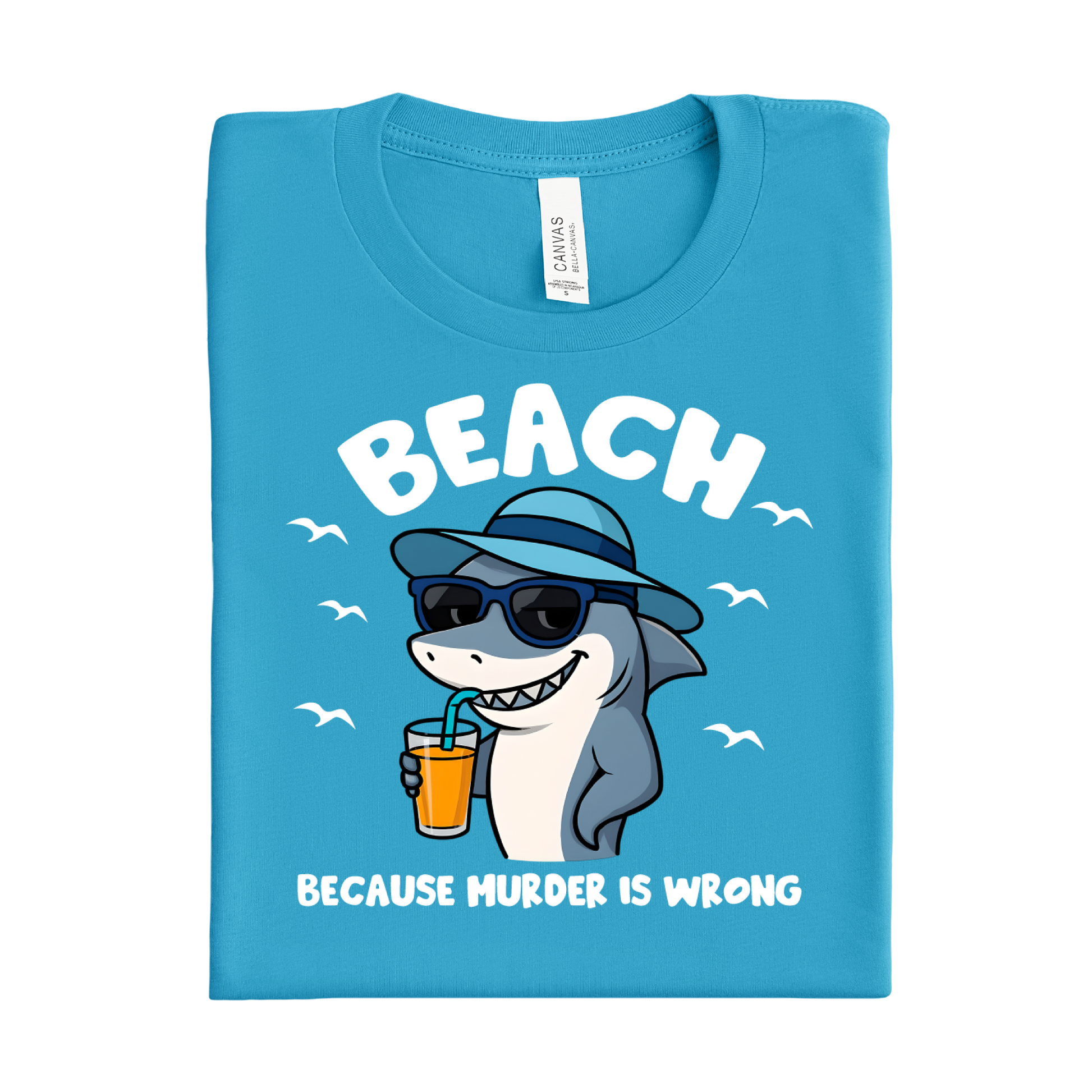 Folded aqua blue t-shirt with a shark graphic and text on a white background