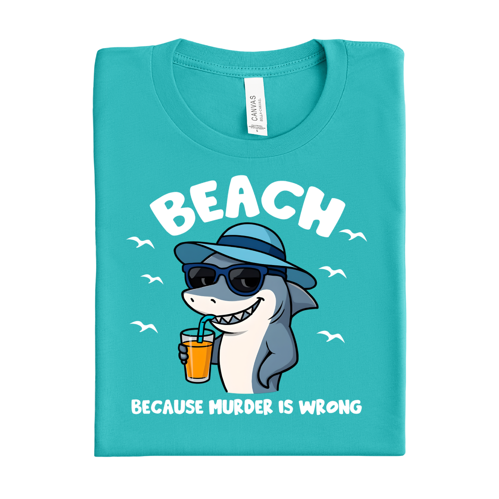 Folded teal t-shirt with a shark graphic and text on a white background