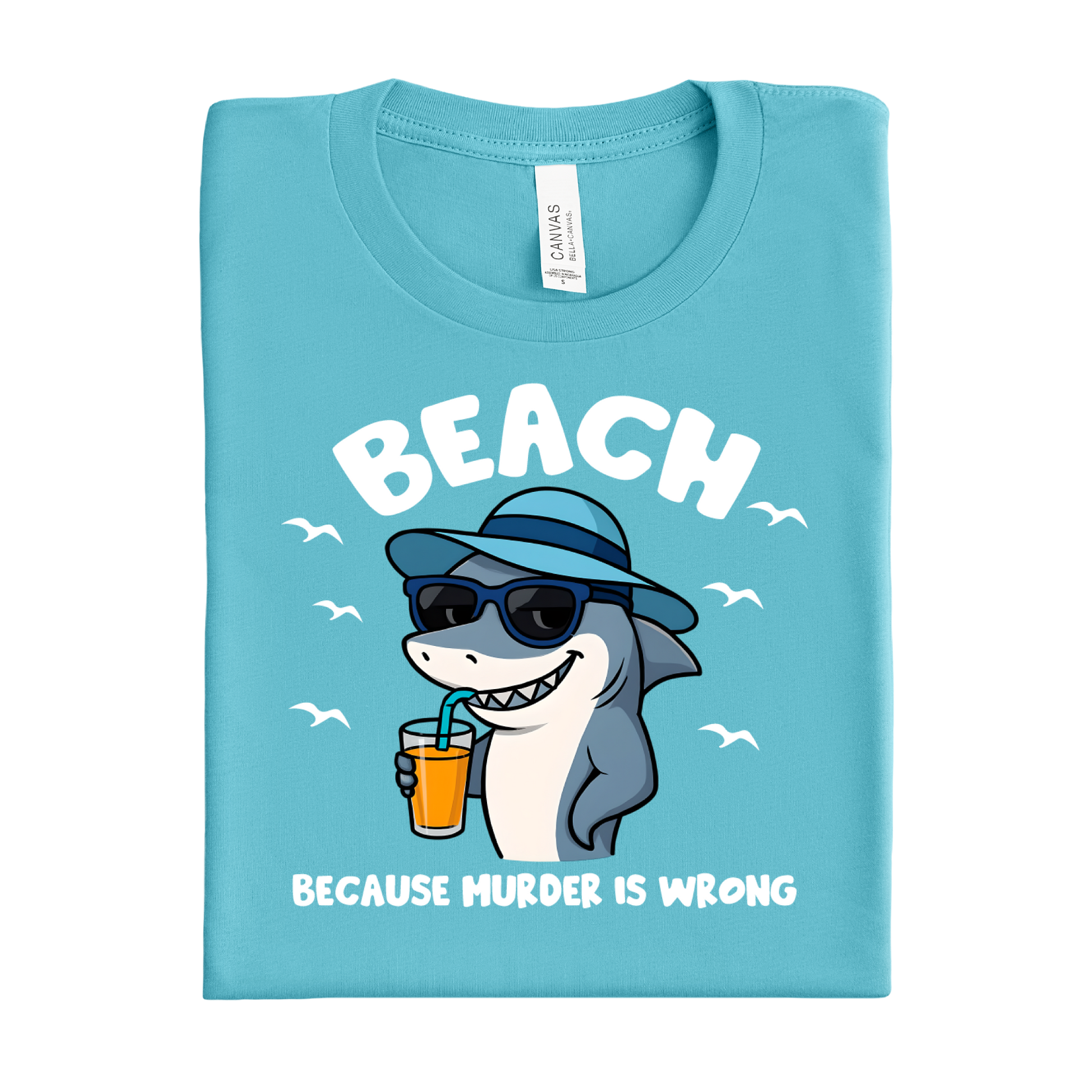 Folded turquoise t-shirt with a shark graphic and text on a white background