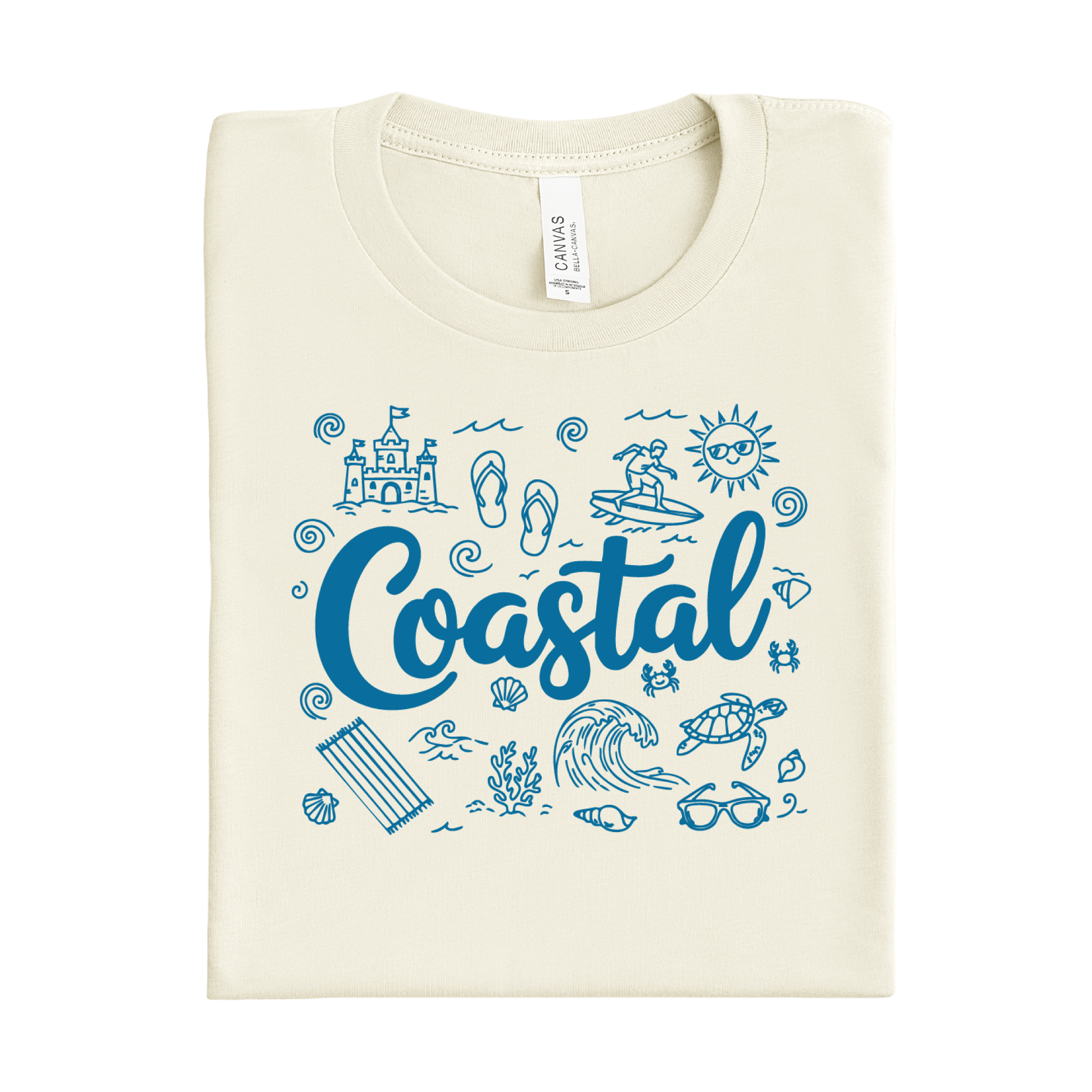 Folded natural colored t-shirt with blue coastal-themed graphics and text on a white background
