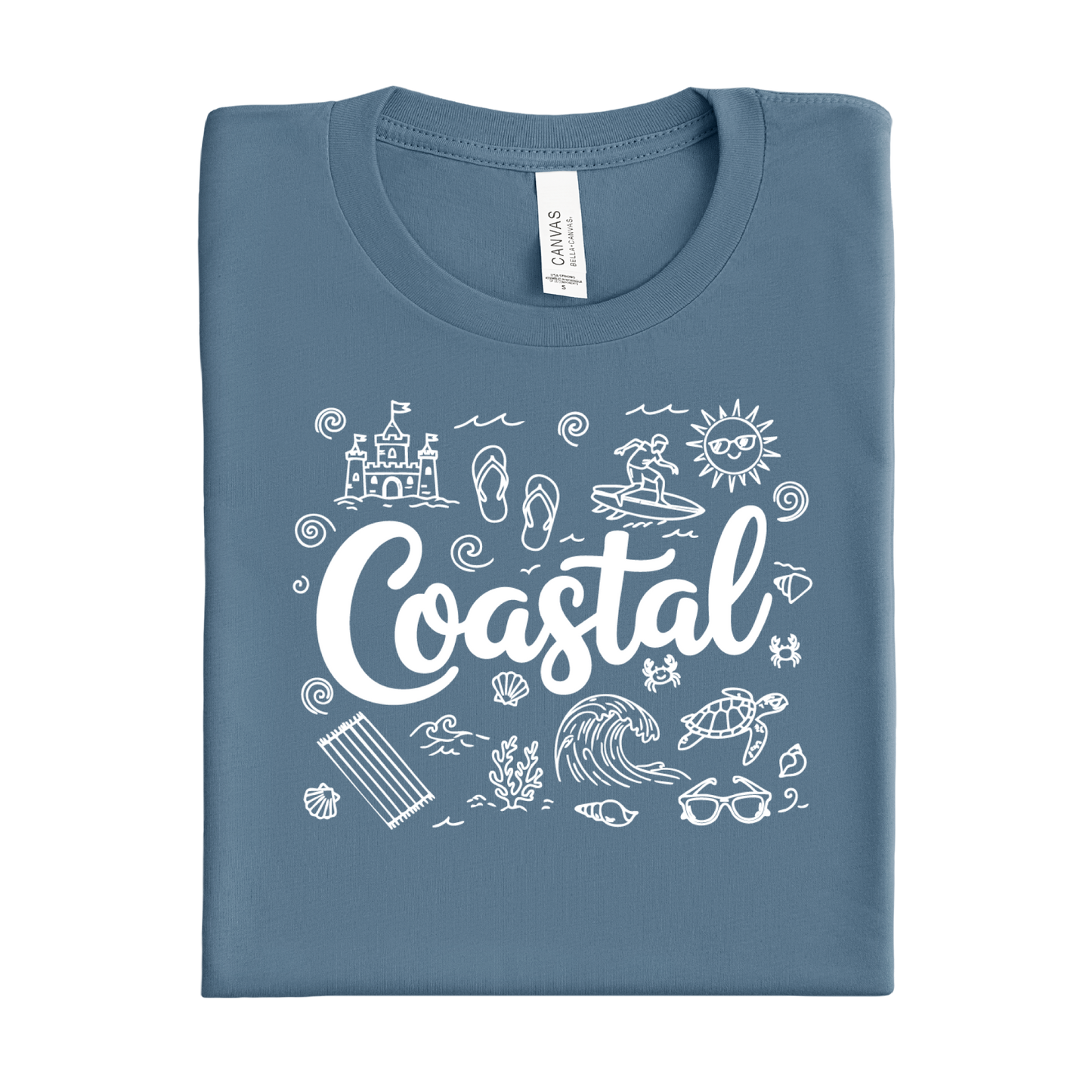 Folded steel blue t-shirt with 'Coastal' design and beach icons on a white background