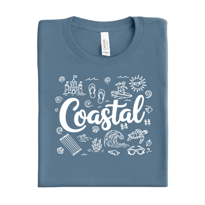 Folded steel blue t-shirt with 'Coastal' design and beach icons on a white background