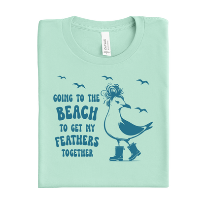 Mint green t-shirt with a graphic of a bird and text on a white background