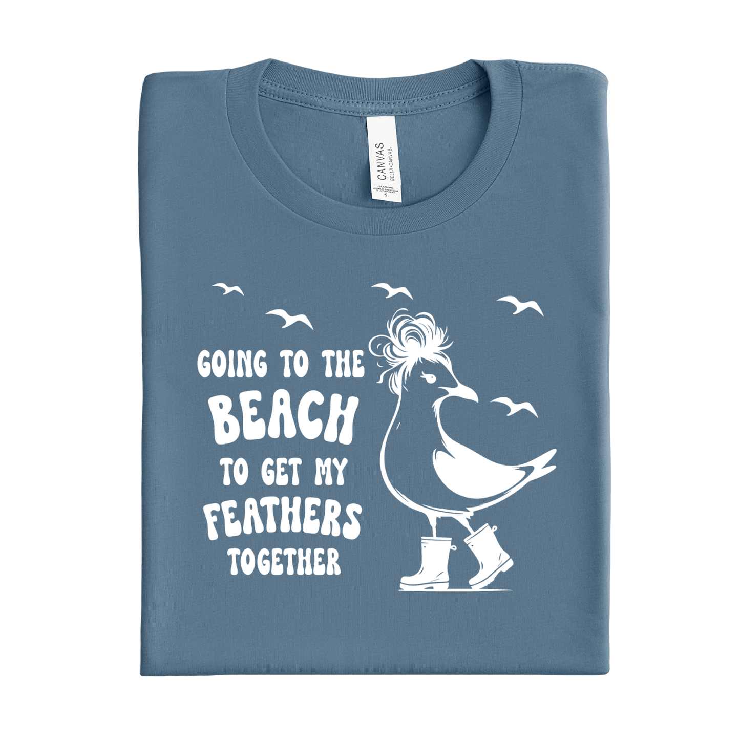 Folded blue steel t-shirt with a white seagull graphic and text on a white background