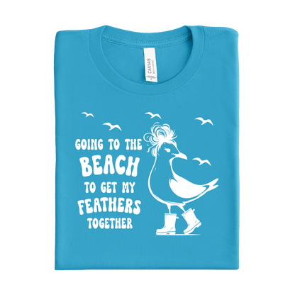 Folded aqua blue t-shirt with a white graphic and text on a white background