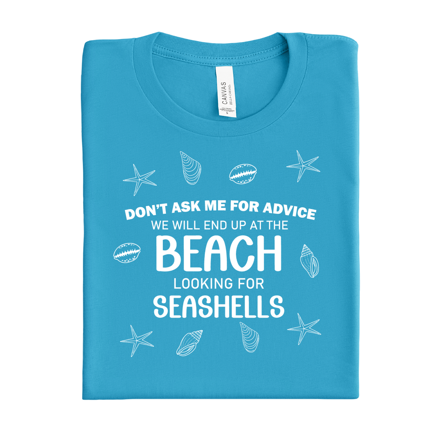 Folded aqua blue t-shirt with beach-themed text and graphics on a white background