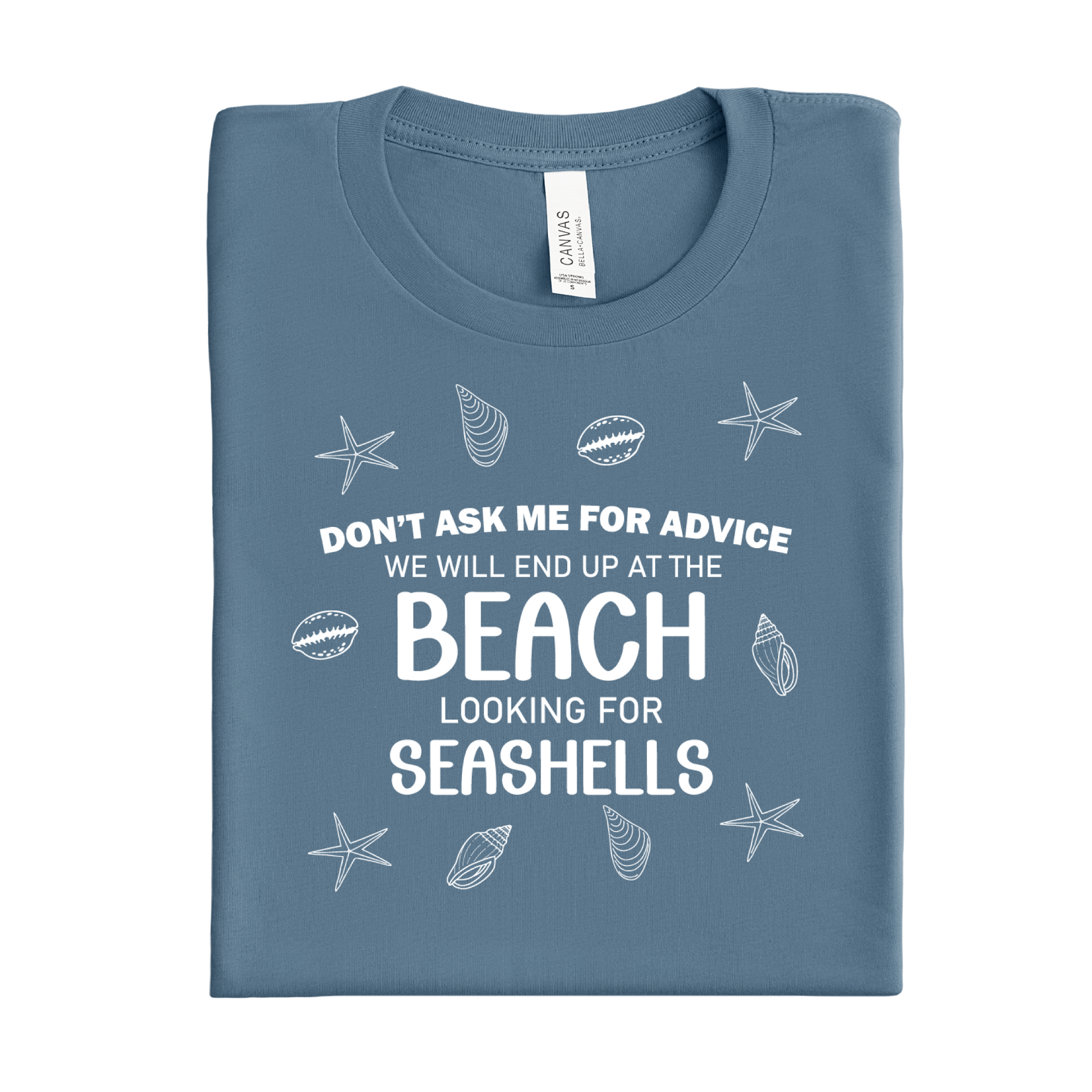 Folded blue steel t-shirt with beach-themed text and graphics on a white background