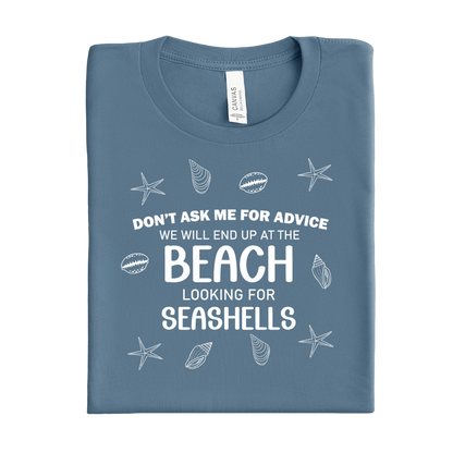 Folded blue steel t-shirt with beach-themed text and graphics on a white background
