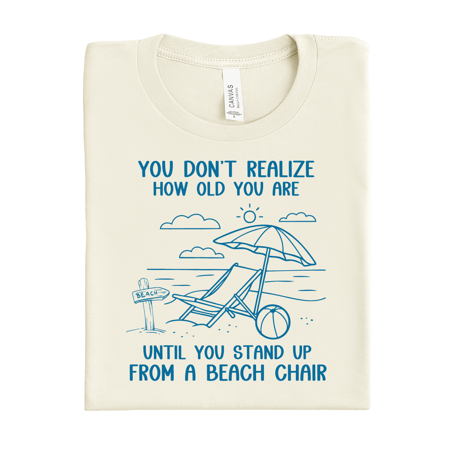 Natural t-shirt with blue beach-themed design and text on a white background