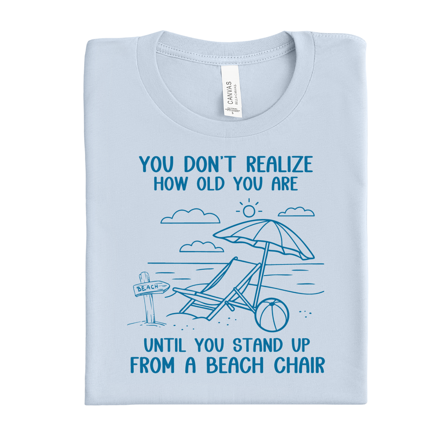 Light blue t-shirt with beach-themed design and text on a white background