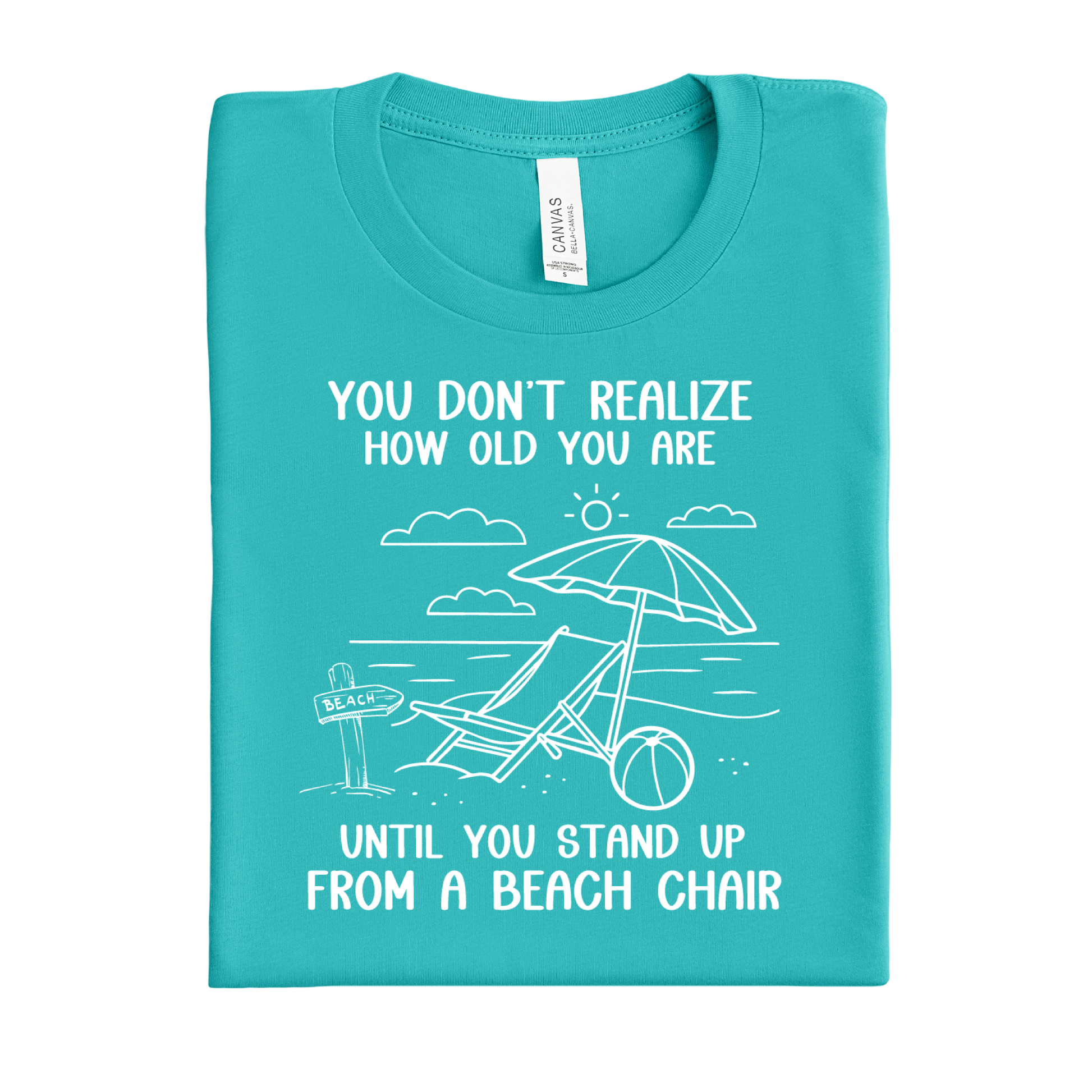 Folded teal t-shirt with beach-themed design and text on a white background