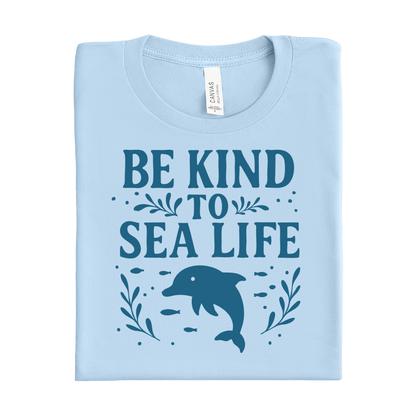 Baby blue t-shirt with 'Be Kind to Sea Life' text and dolphin graphic on a white background