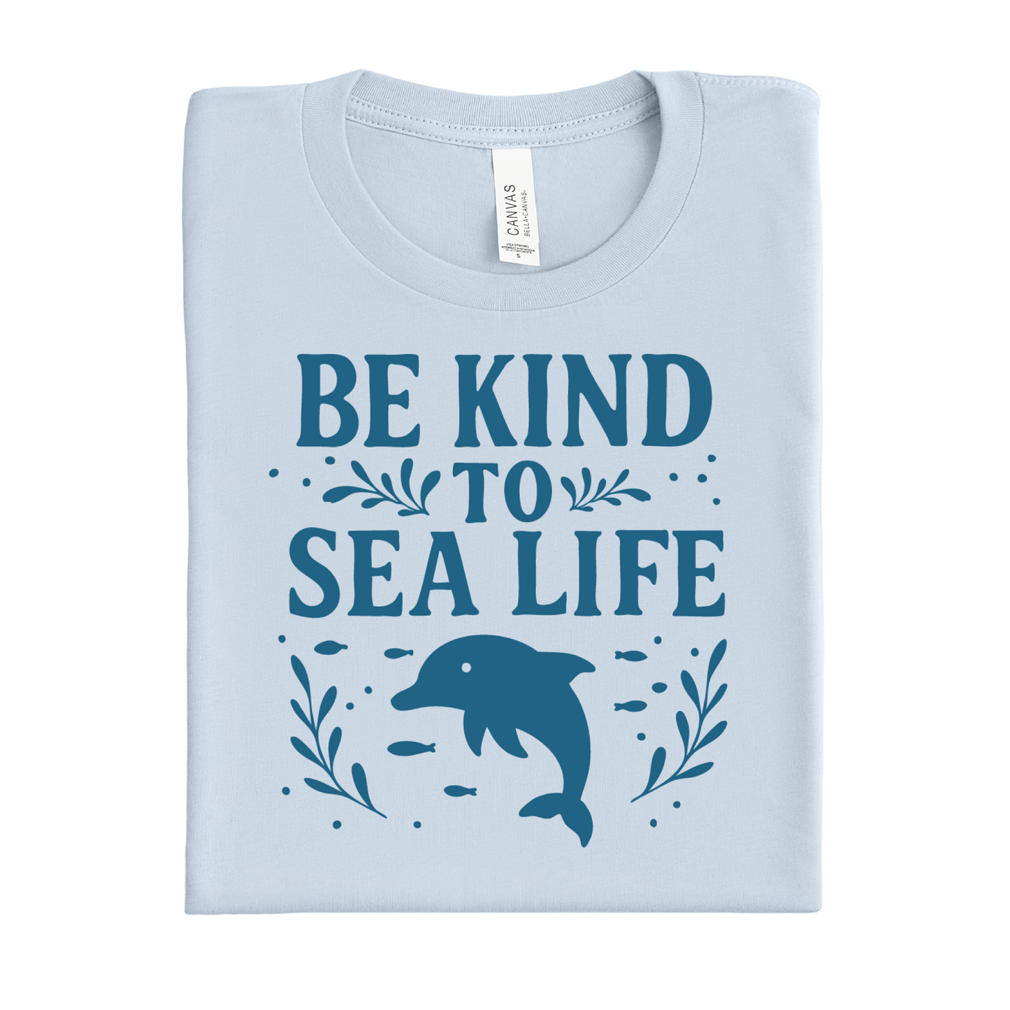 Light blue t-shirt with 'Be Kind to Sea Life' text and dolphin graphic on a white background