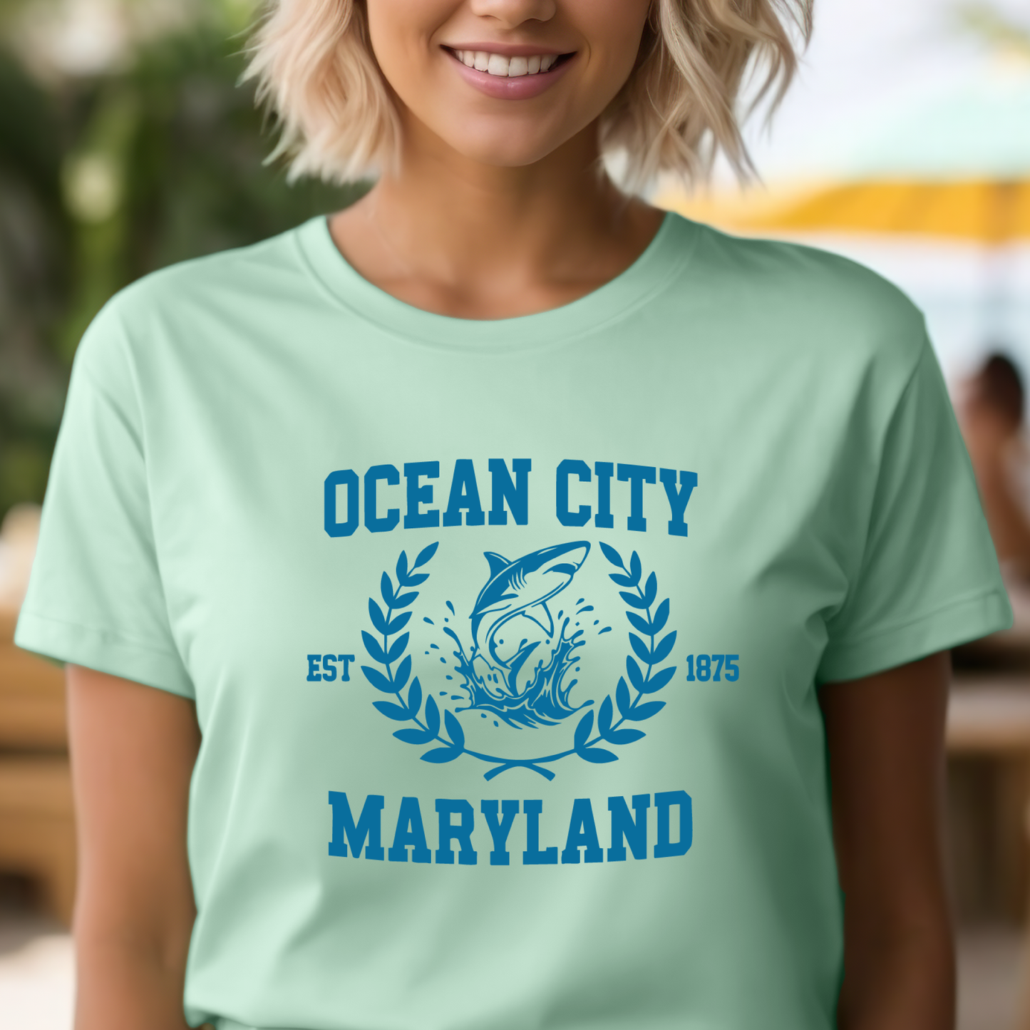 Person wearing a light green t-shirt with 'Ocean City, Maryland' design.