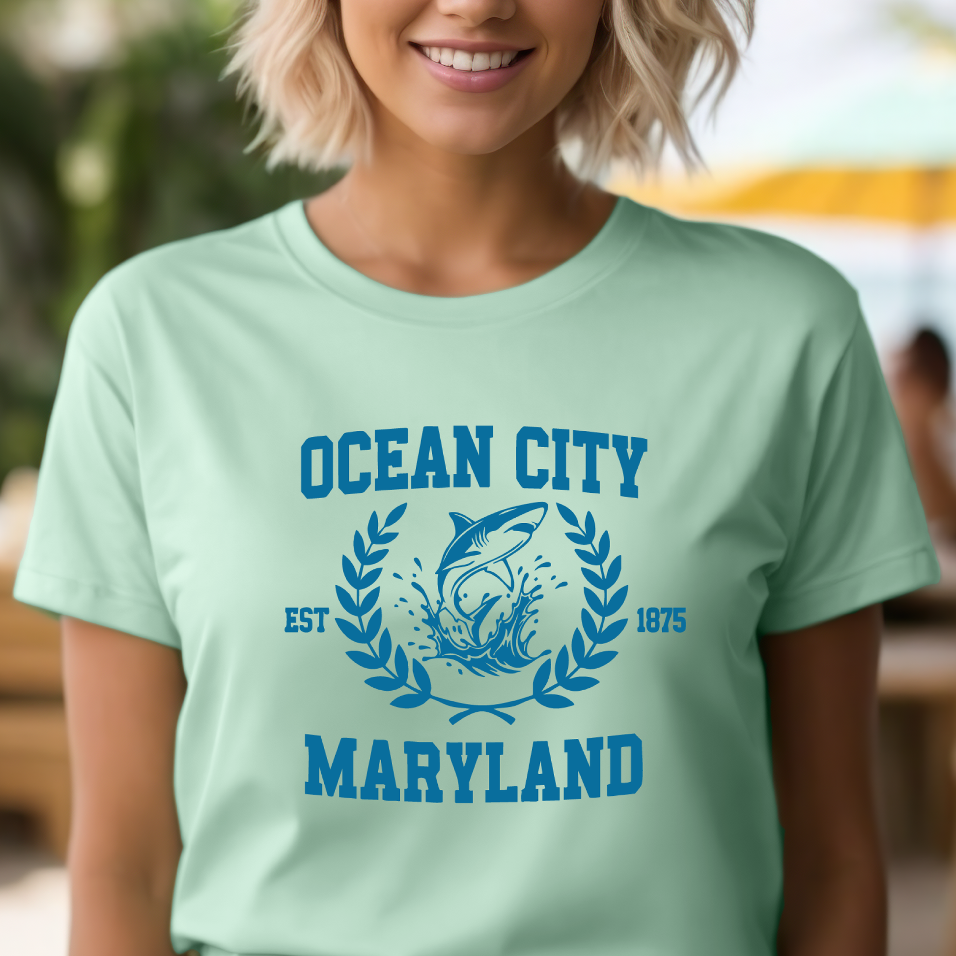 Person wearing a light green t-shirt with 'Ocean City, Maryland' design.