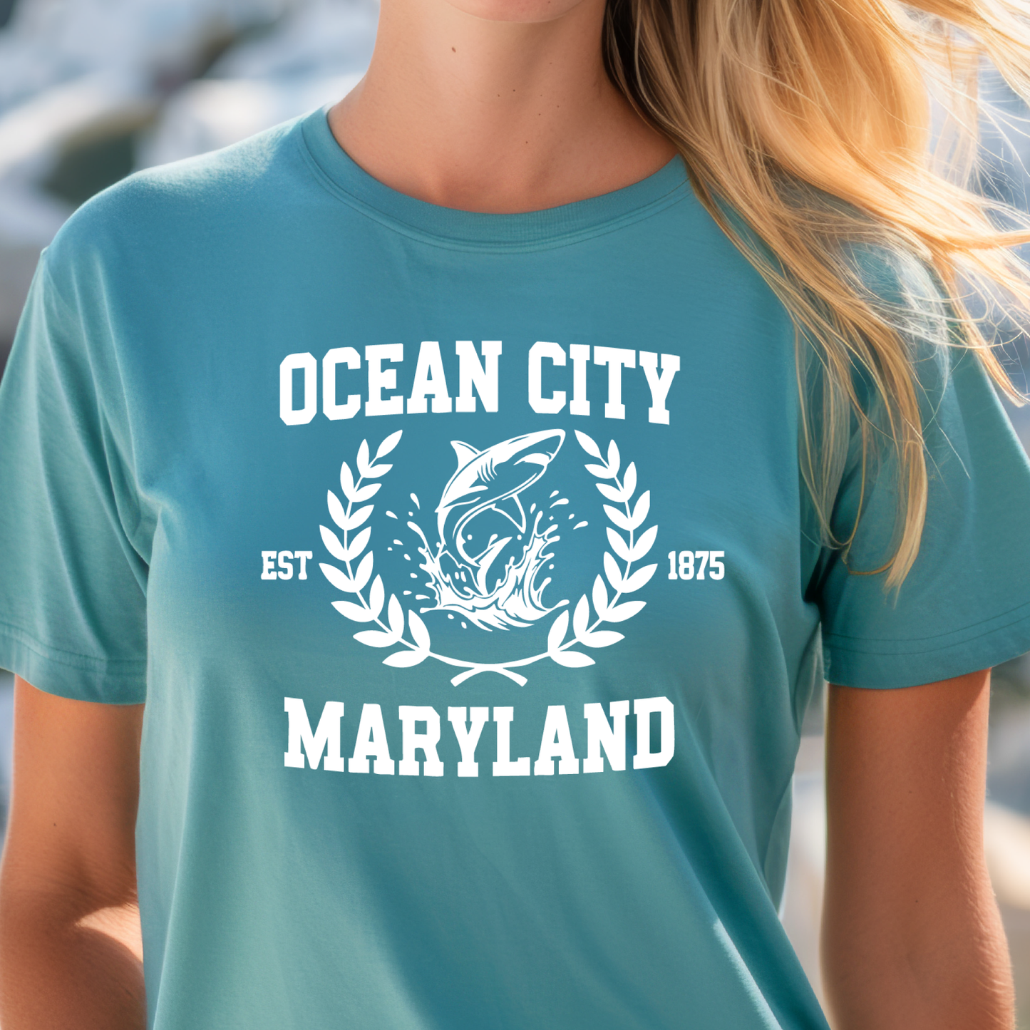 Person wearing a turquoise t-shirt with 'Ocean City, Maryland' design.