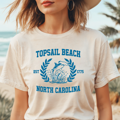 Person wearing a 'Topsail Beach, North Carolina' t-shirt with a beach background