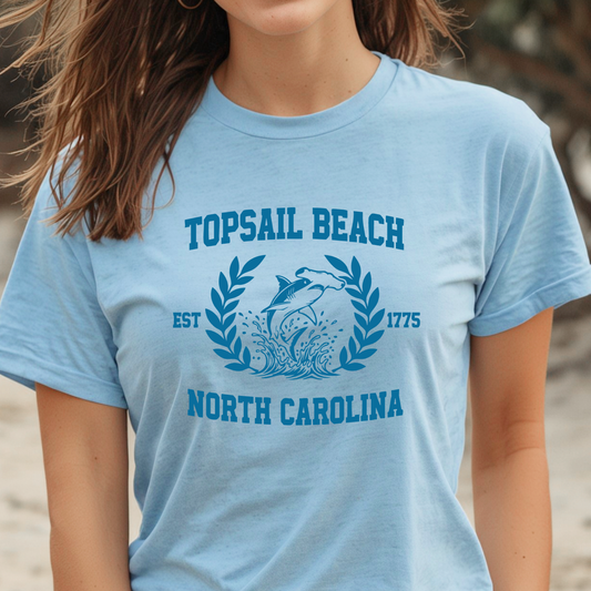 Person wearing a light blue t-shirt with 'Topsail Beach, North Carolina' design.