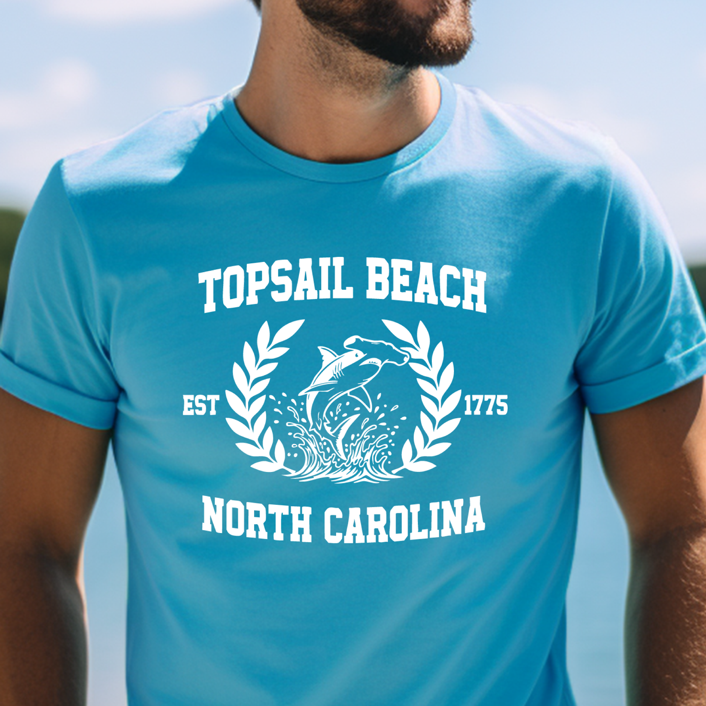 Aqua Blue t-shirt with 'Topsail Beach, North Carolina' design featuring a dolphin and laurel leaves.