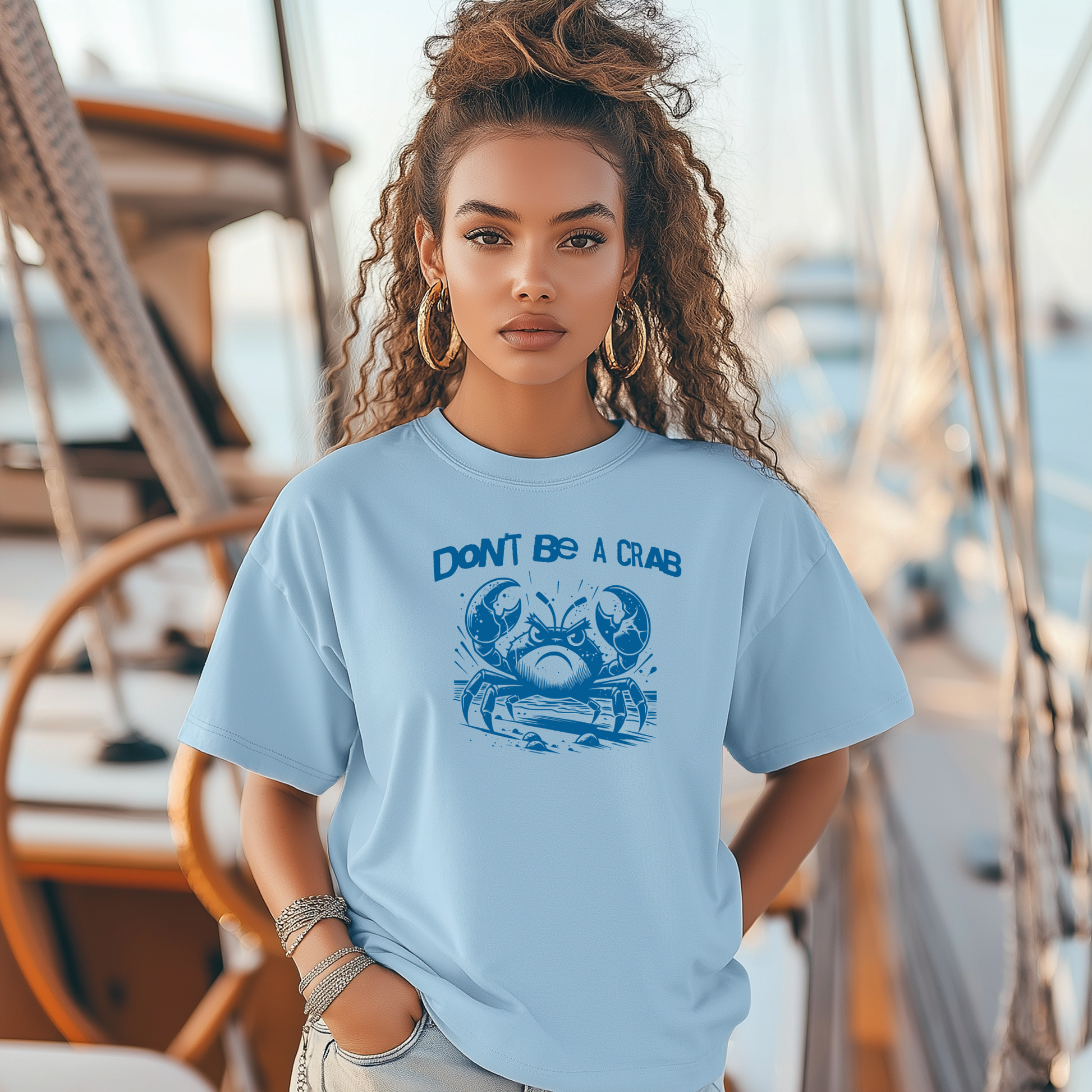Bella Canvas 3001 "Don't Be A Crab" t shirt with cute angry crab in one color graphic. Picture of a girl standing on a boat wearing a t shirt.