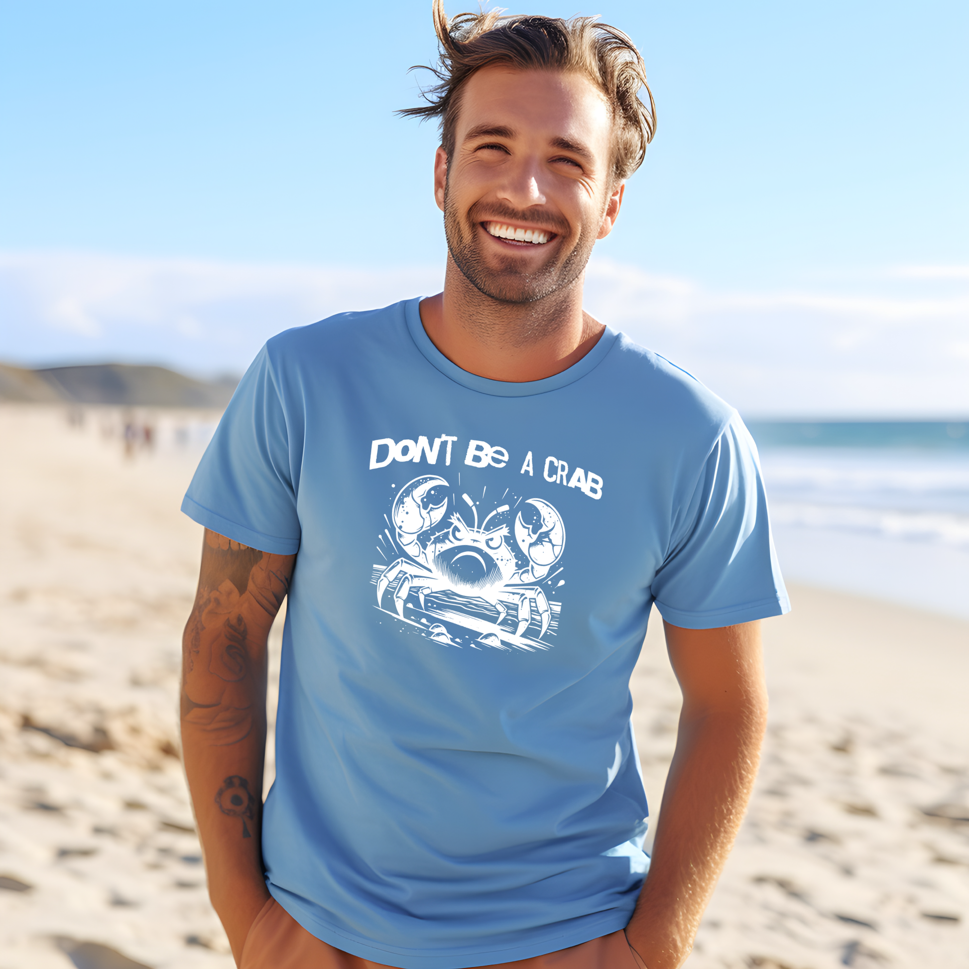 Bella Canvas 3001 "Don't Be A Crab" t shirt with cute angry crab in one color graphic. Picture of a man standing on the beach wearing a t shirt.