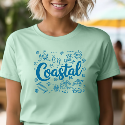 Person wearing a light green t-shirt with 'Coastal' design and beach icons.