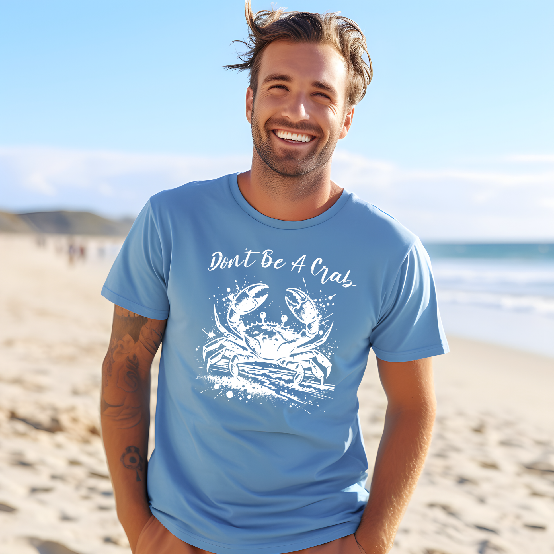 Bella and Canvas 3001 "Don't Be A Crab" t shirt with crab splashing in water one color graphic. Picture of a man standing on the beach wearing a t shirt.