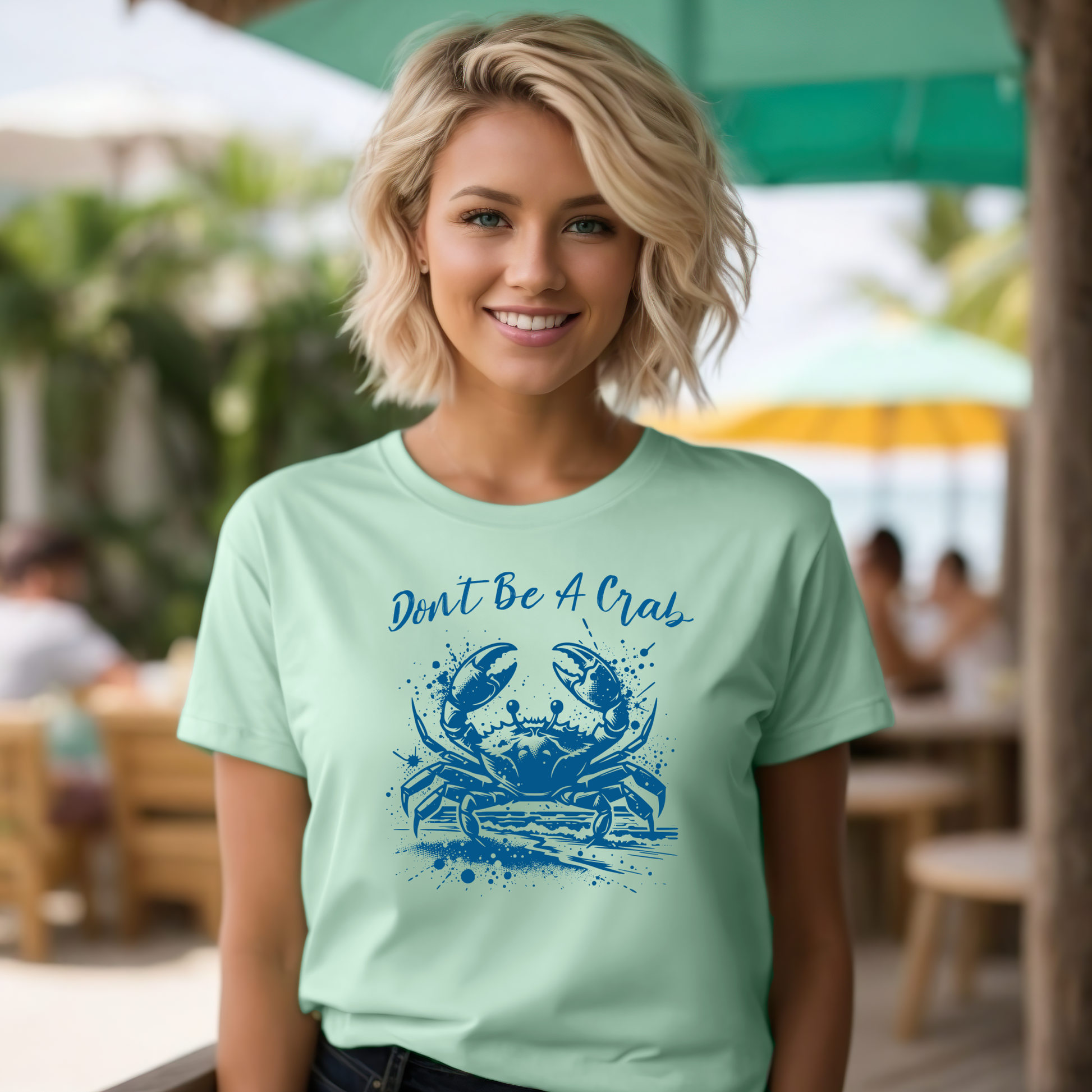 Bella and Canvas 3001 "Don't Be A Crab" t shirt with crab splashing in water one color graphic. Picture of a girl standing in a beach house wearing a t shirt.