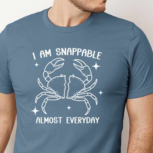 Steel Blue t-shirt with a crab graphic and text worn by a person