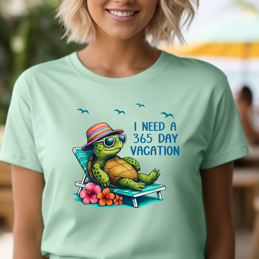 Person wearing a light green t-shirt with a turtle graphic and text, standing outdoors.