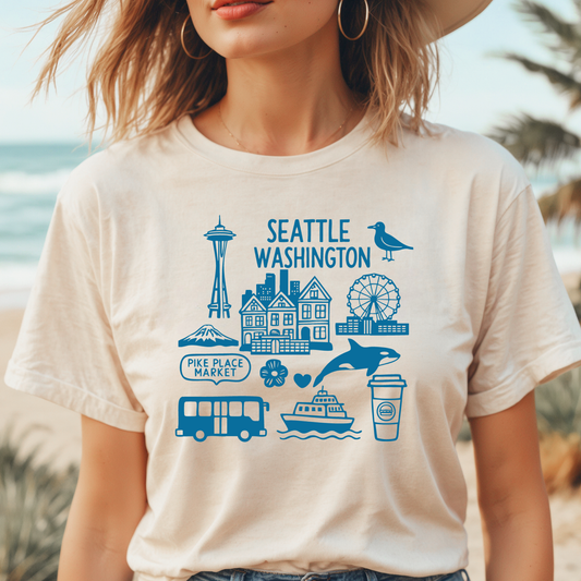 Person wearing a t-shirt with Seattle-themed graphics and text.