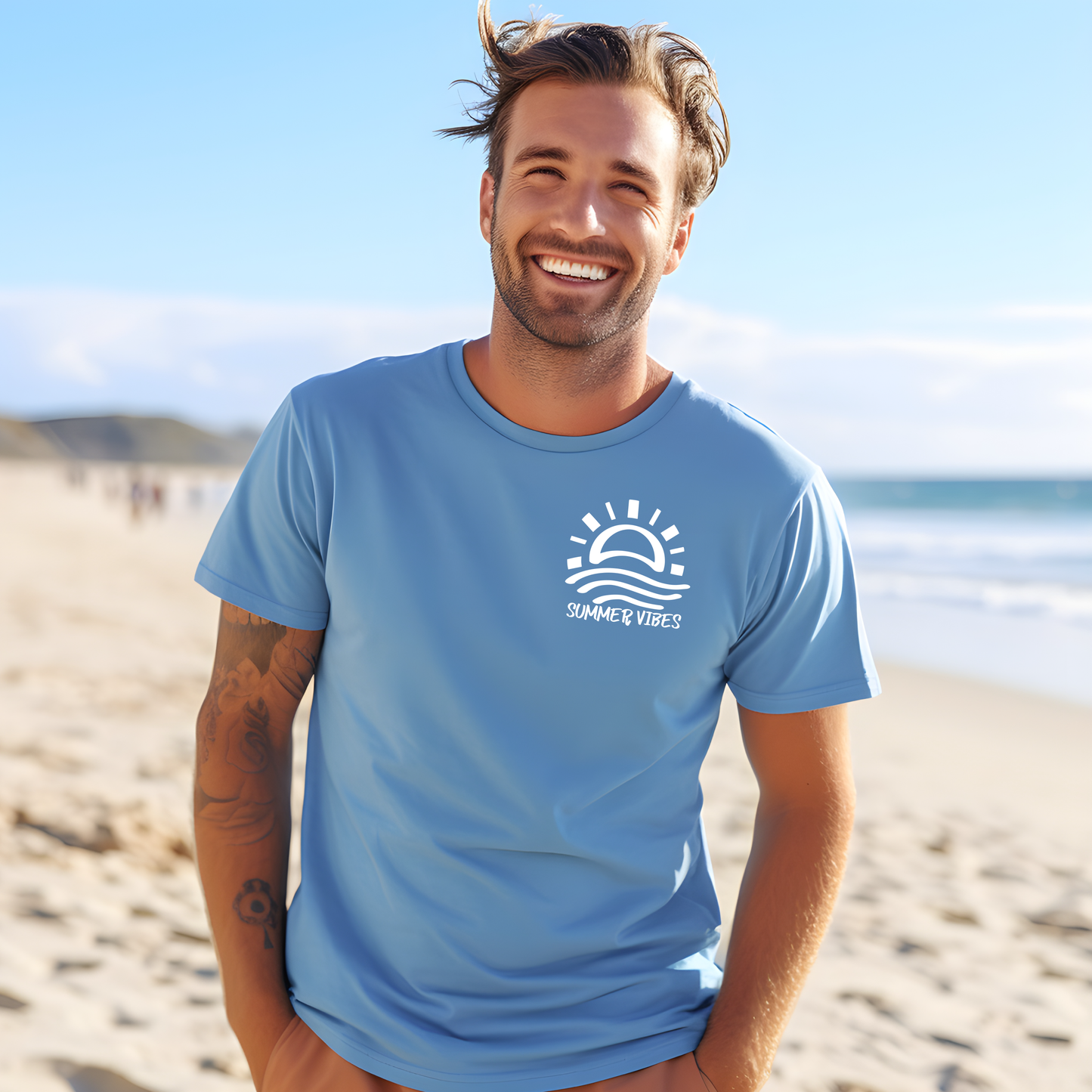 Bella and Canvas 3001 "Summer Vibes" t shirt with sun and waves one color graphic. Picture of a man standing on the beach wearing a t shirt.
