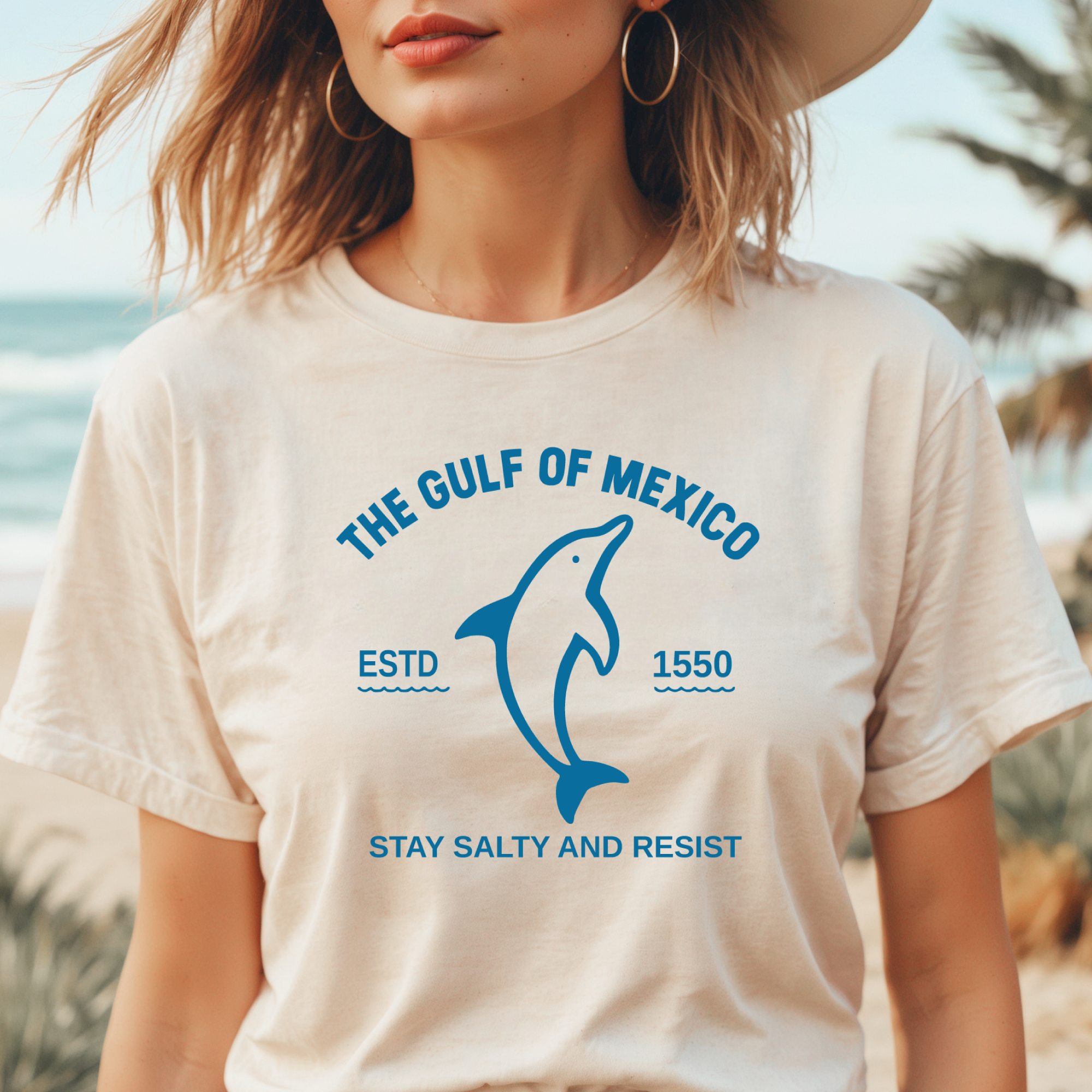 Person wearing a t-shirt with 'The Gulf of Mexico' design and text.