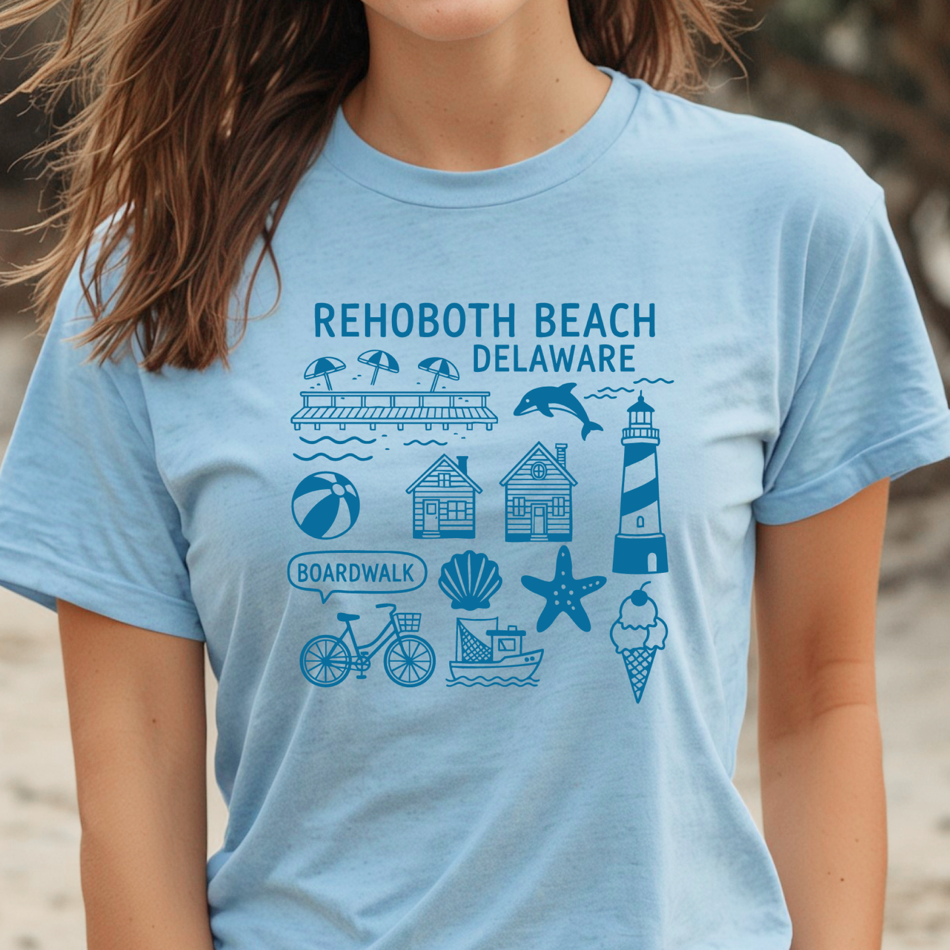 Person wearing a light blue t-shirt with Rehoboth Beach, Delaware graphics.