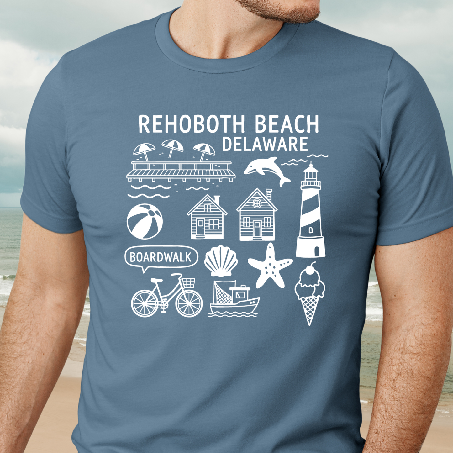 Person wearing a steel blue t-shirt with Rehoboth Beach, Delaware graphics.