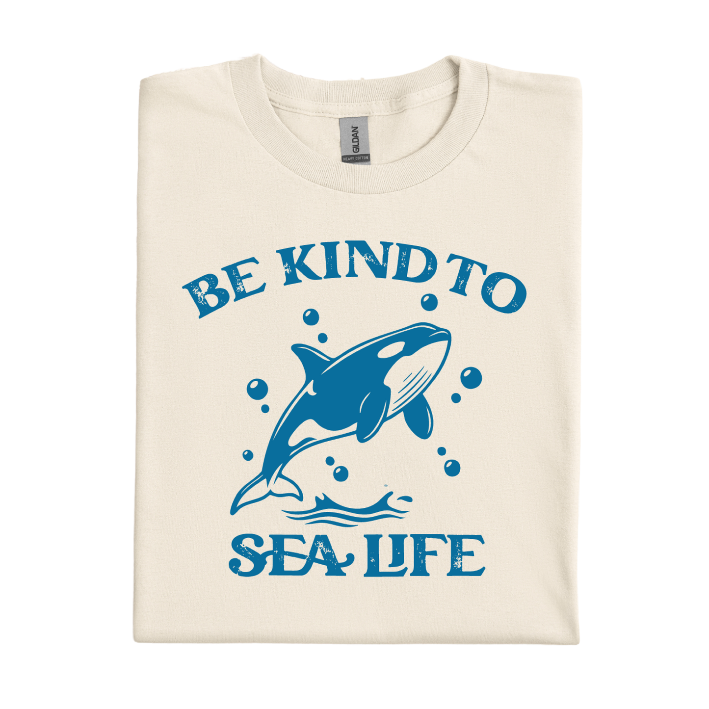 natural t-shirt with blue whale graphic and 'Be Kind to Sea Life' text on a white background