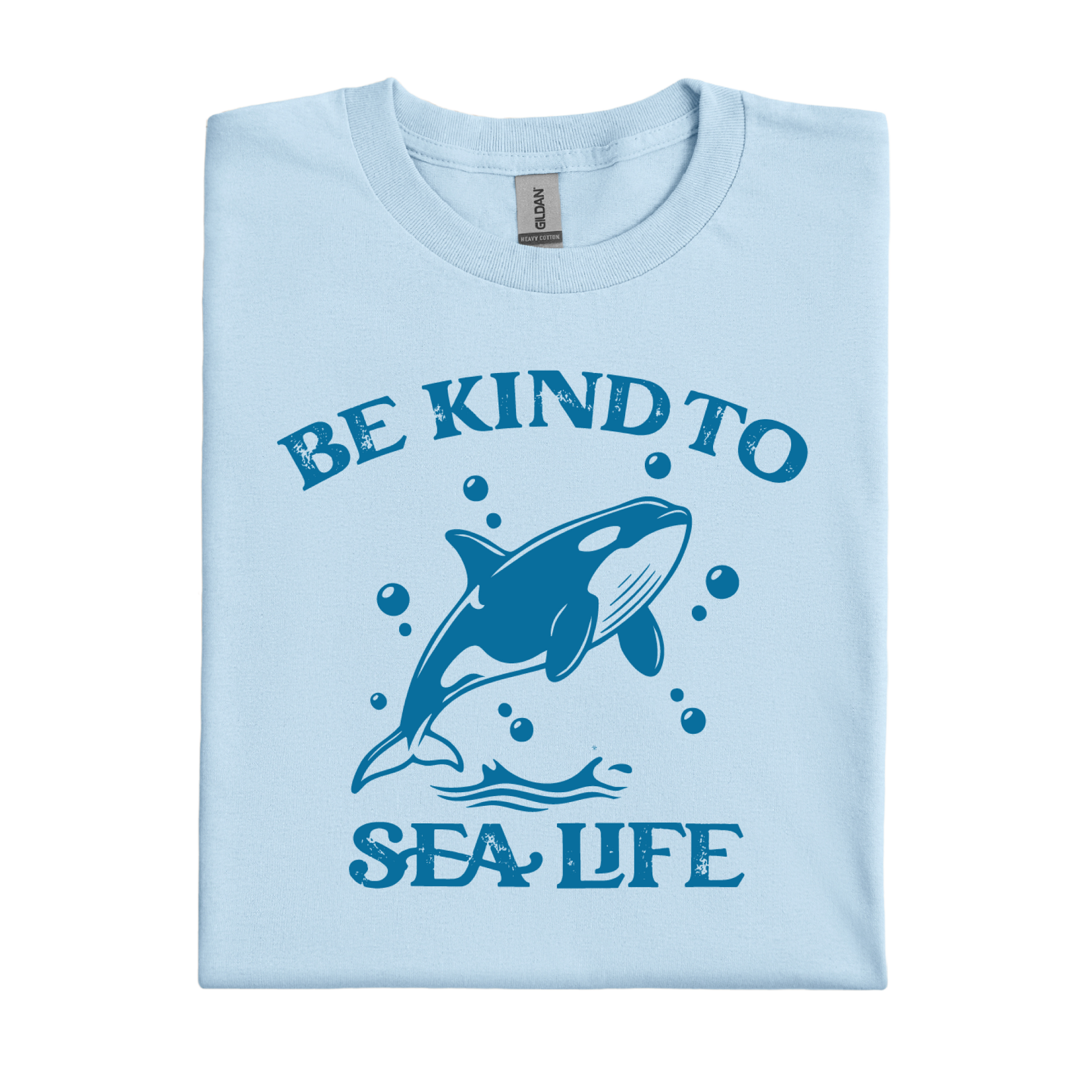 Light blue t-shirt with a whale graphic and text 'Be Kind to Sea Life' on a white background