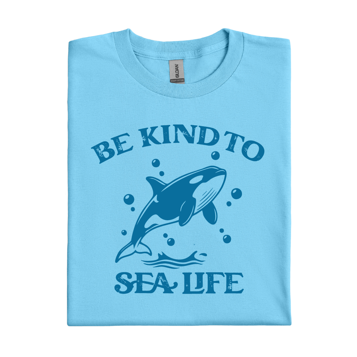 sky blue t-shirt with a whale graphic and text 'Be Kind to Sea Life' on a white background