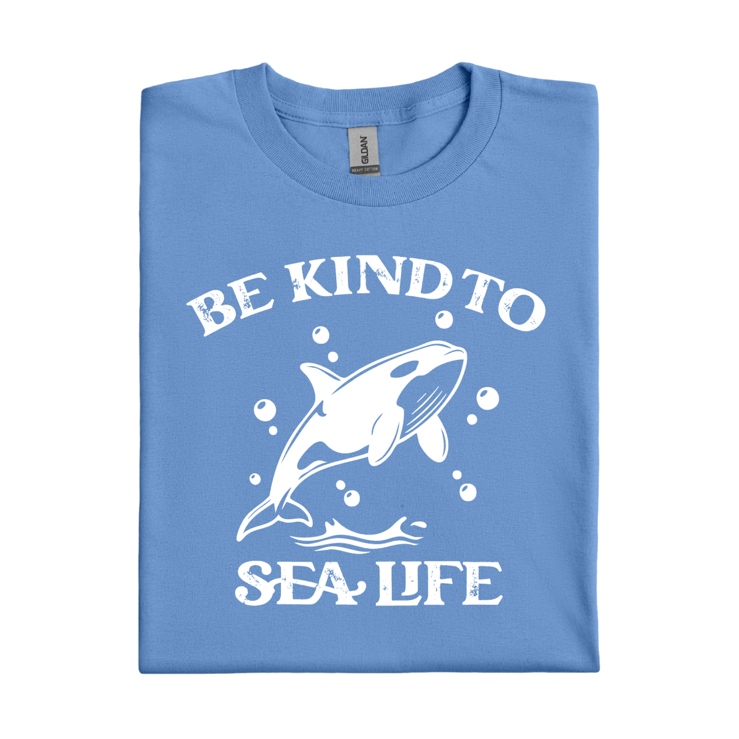 Folded Carolina blue t-shirt with white orca and text design on a white background
